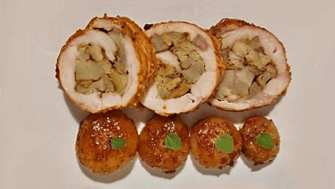 coniglio ripieno di carciofi e grana con cipolline borretane, glassate al limone. ricette coniglio, coniglio ripieno. ricette carciofi.